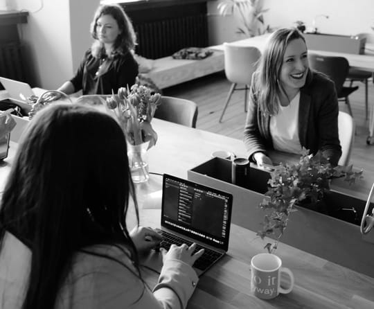 three female data analyst in the office ,working.